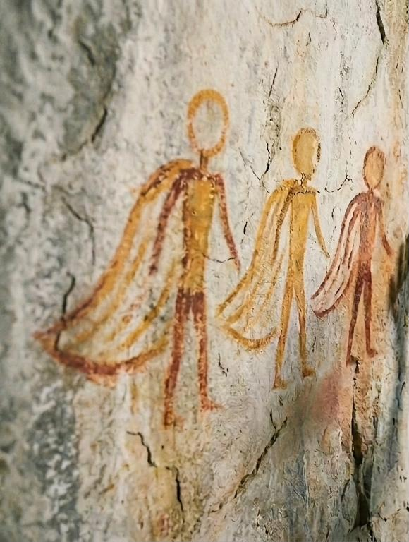 The Wearer figures, close on the wall